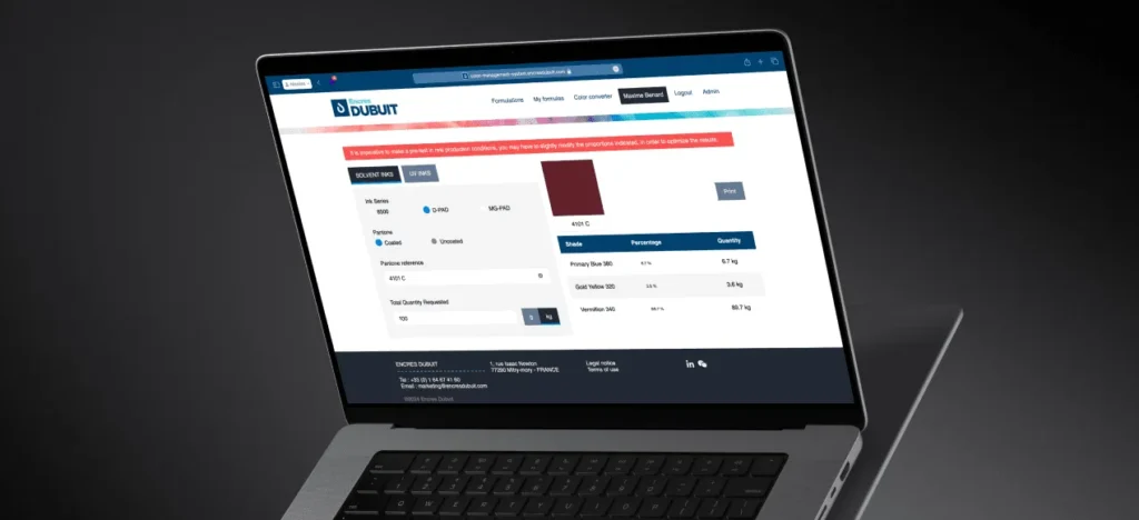 Ordinateur portable affichant le calcul d’une encre bordeaux dans l’application Encres Dubuit, avec le pourcentage et la quantité de chaque composant