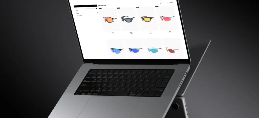 Ordinateur portable affichant la liste des lunettes de soleil de sport de la boutique Demetz, aux verres colorés
