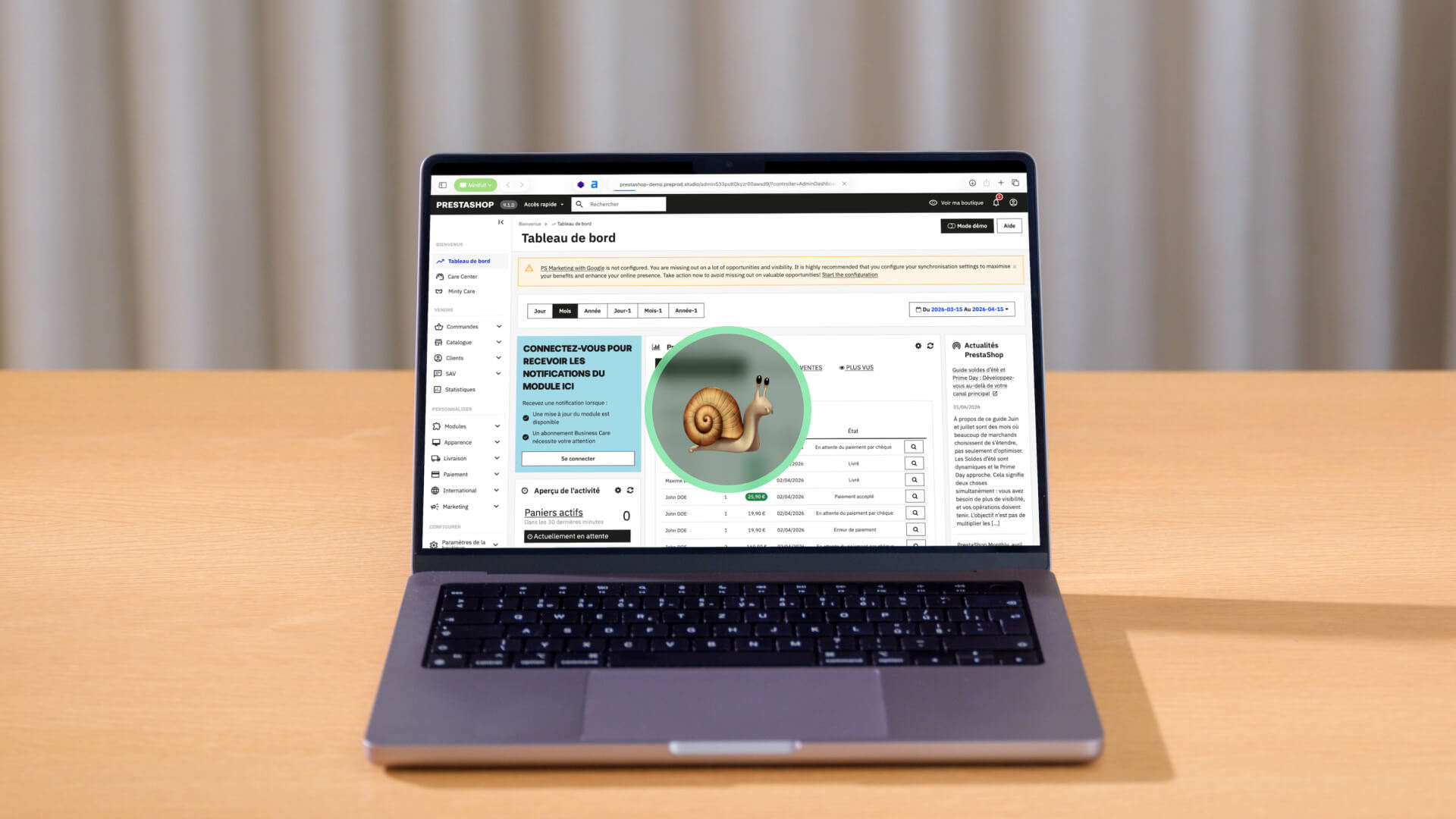 Laptop on a wooden table showing a web admin dashboard with a green circular highlight around a snail illustration in the center of the screen.